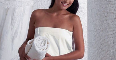 Boca Terry Microfiber Spa Wrap in white, shown on a hanger demonstrating its soft texture and elegant design for spa professionals.