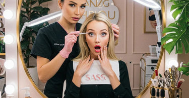 Microblading brows in progress with a close-up of a technician creating hair-like strokes