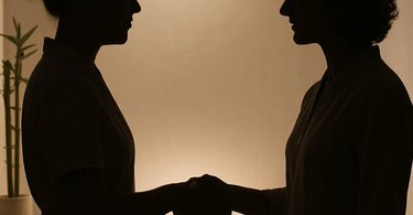 Professional spa therapist greeting client with elbow bump instead of handshake in modern salon setting