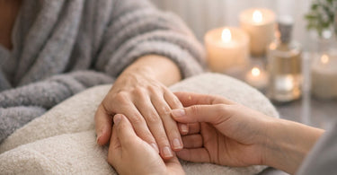 A serene image of a gentle hand massage during a manicure, with soft focus and warm lighting, evoking peace and quiet care.