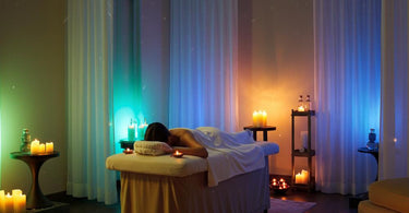 A serene spa room with soft blue lighting and calming decor, showcasing the power of color therapy in creating a stress-free environment.