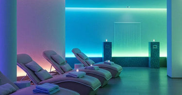 A serene spa room with soft blue and green decor, showcasing the calming effects of color therapy.