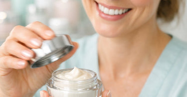 Close-up of a professional aesthetician's hands opening a luxury skincare jar, capturing the moment of the seal breaking