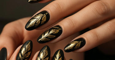 Luxurious gold leaf nail design with intricate detailing on a manicured hand