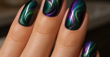 Close-up of stunning magnetic nail art design showing cat-eye effect with blue and silver gel polish