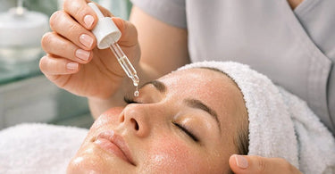 Close-up of a calming gel mask being applied to a client's face after a microneedling treatment in a serene spa setting