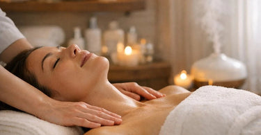 A client experiencing deep relaxation during a spa facial treatment, with a serene expression and warm towels.