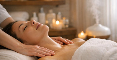 A client experiencing deep relaxation during a spa facial treatment, with a serene expression and warm towels.