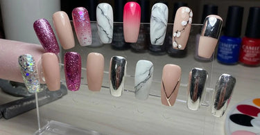 A variety of trendy coffin nail designs displayed in a professional salon setting