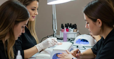 Nail technician practicing advanced nail art techniques