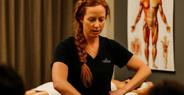 Spa staff receiving training in various massage therapy techniques