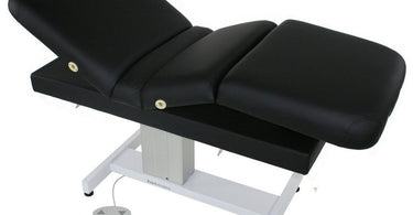 Luxurious Venetian Treatment Table with Multipro Adjustable Top by TouchAmerica in a modern spa setting, featuring plush upholstery and electric lift capability.