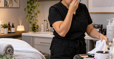 Professional spa treatment room with aromatherapy diffuser, fresh towels, and neatly arranged skincare supplies illustrating how spa odors can change throughout the day