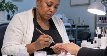 Professional nail salon acrylic application illustrating how cold temperatures affect acrylic powder and liquid monomer setting time