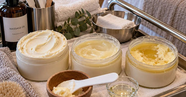 Professional spa body butter in a warm treatment room showing a softened creamy texture beside skincare supplies and treatment accessories