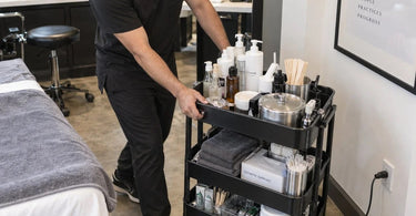 A salon trolley parked safely away from electrical cords to prevent tripping and electrical hazards in a spa or salon setting.