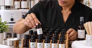 Essential oil bottles organized upright in clean drip-free professional spa storage