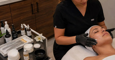 Spa professional applying a luxurious finishing touch to a client in a serene spa environment