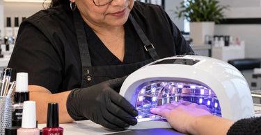 Professional UV LED nail curing lamp with reflective interior surfaces designed to help distribute curing light evenly across gel manicures