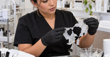 Professional peel-off facial mask demonstrating uneven removal and torn sections during a spa skincare treatment