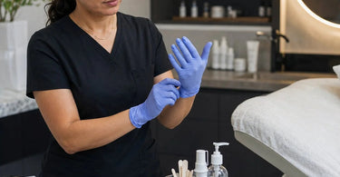 Professional applying beauty treatment with powder-free gloves
