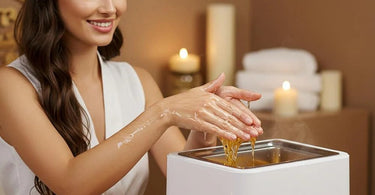 Paraffin wax treatment being applied to hands and feet in a spa setting
