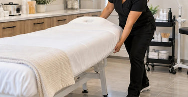 Professional spa treatment bed positioned on smooth flooring in a treatment room, illustrating treatment bed sliding, stability, and floor traction concerns