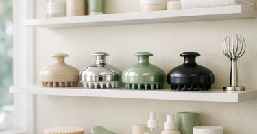 A curated retail display featuring various scalp massagers and scalp care products in a modern salon setting