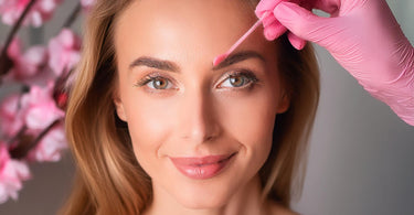 Woman getting waxing treatment at a spa