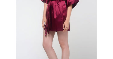 Wine red women's satin kimono short robe displayed on a dress form, showcasing the luxurious fabric and elegant style perfect for spa and salon use.