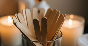 Assorted wooden waxing sticks and applicators