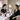 Nail technician applying nail art design in a salon
