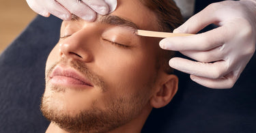 Eyebrow waxing in a spa setting