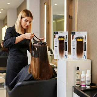 Various types of salon hair extensions displayed on a table