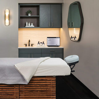 A well-prepared massage table with plush sheets in a serene spa room