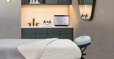 A well-prepared massage table with plush sheets in a serene spa room