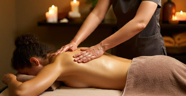 Massage therapist performing effleurage technique on a client's back