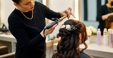 Stylist creating an elegant updo for a client in a salon