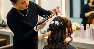 Stylist creating an elegant updo for a client in a salon