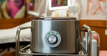 Professional wax warmer buying guide image showing a wax warmer in a salon setup