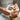 Hot towels being applied in a spa setting by an esthetician to relax and open skin pores