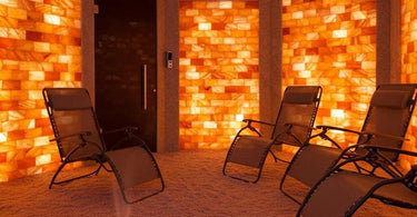 A serene salt therapy room with Himalayan salt walls and comfortable seating