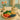 A vibrant and healthy day of eating for a massage therapist, featuring fresh meals and snacks on a clean background