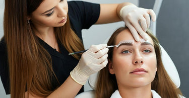 Professional eyebrow waxing treatment for clients with sensitive skin