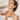 A spa professional performing a targeted massage and skincare treatment on a client's neck and d&eacute;colletage to address tech neck and wrinkles.