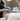 Professional esthetician performing a waxing treatment on a client