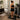 A professional spray tan drying area featuring a tanning booth, fan, and mirror to ensure a flawless, streak-free finish for clients.