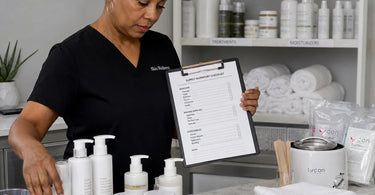 Benefits of Auditing Your Spa Supplies Before The Busy Season: A well-organized professional spa backbar with neatly arranged towels, waxing supplies, and skincare products, symbolizing efficiency and preparedness for a busy season.