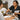 Luxury hot stone massage being applied during a pedicure with smooth black basalt stones at a professional spa.