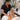 A woman relaxing during a spa facial with a therapist performing a soothing neck and shoulder massage.